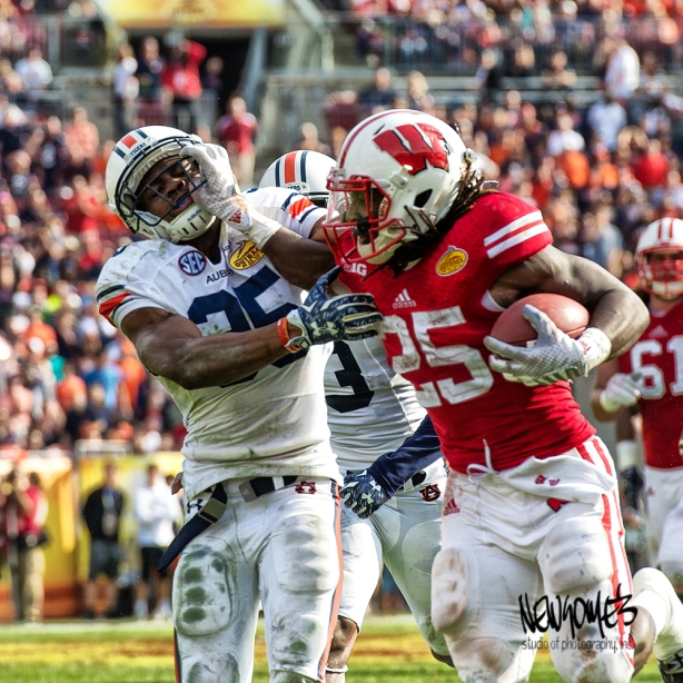 Wisconsin's Melvin Gordon and Auburn's Joseph Turner battle it out on the way to the end zone.