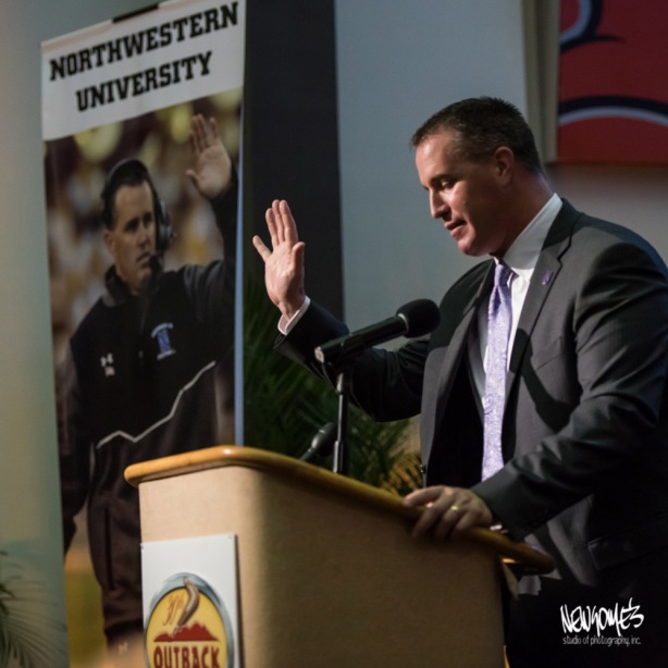 NW Coach Pat Fitzgerald high fiving himself. 